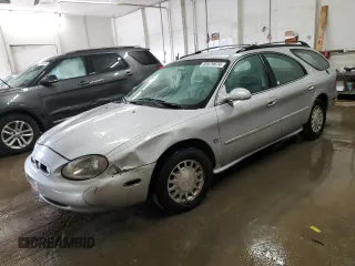 1999 Mercury Sable z VIN 1MEFM58S6XA647250, wystawiony jako Copart lot #83479674 z przebiegiem 166 550 mil mil oraz Szkody całkowita. Historia ofert i sprzedaży dostępna na DreamBid. Obrazek 1.