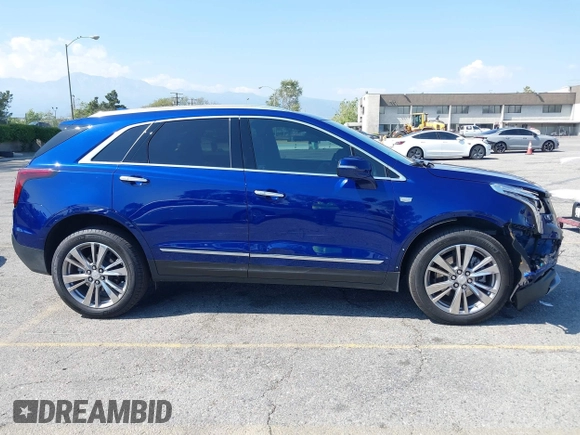 2023 Cadillac XT5 FWD Premium Luxury z VIN 1GYKNCRS3PZ176654, wystawiony jako IAAI lot #42136259 z przebiegiem 20 403 mil mil oraz . Historia ofert i sprzedaży dostępna na DreamBid. Obrazek 14.
