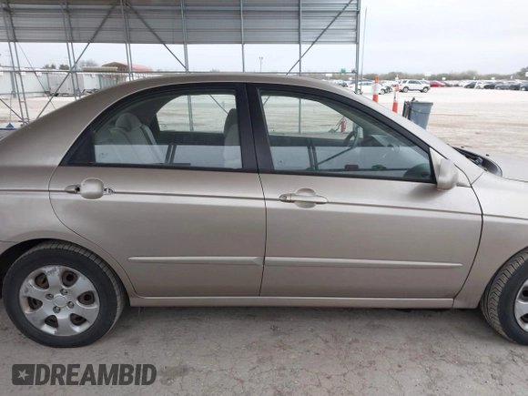2004 Kia Spectra LX with VIN KNAFE121245064294, listed as a IAAI auction lot 41424241 with 110,136 mi miles. Bid and sale history available at carsss.com. Image 13.