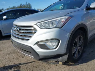 2014 Hyundai Santa Fe Limited with VIN KM8SNDHF4EU053385, listed as a IAAI auction lot 42021698 with 168,199 mi miles. Bid and sale history available at carsss.com. Image 6.