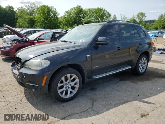 2012 BMW X5 35i with VIN 5UXZV4C59CL752661, listed as a Copart auction lot 58590305 with 101,725 mi miles and Salvage title. Bid and sale history available at DreamBid. Image 1.