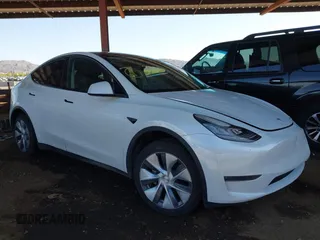 2023 Tesla Model Y Long Range with VIN 7SAYGDEE5PA085472, listed as a IAAI auction lot 41972150 with 66,012 mi miles and . Bid and sale history available at DreamBid. Image 1.