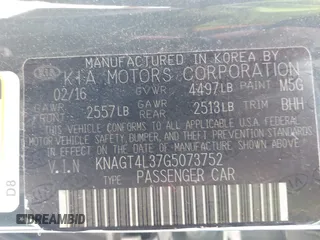 2016 Kia Optima LX with VIN KNAGT4L37G5073752, listed as a IAAI auction lot 42132621 with 136,818 mi miles. Bid and sale history available at carsss.com. Image 9.