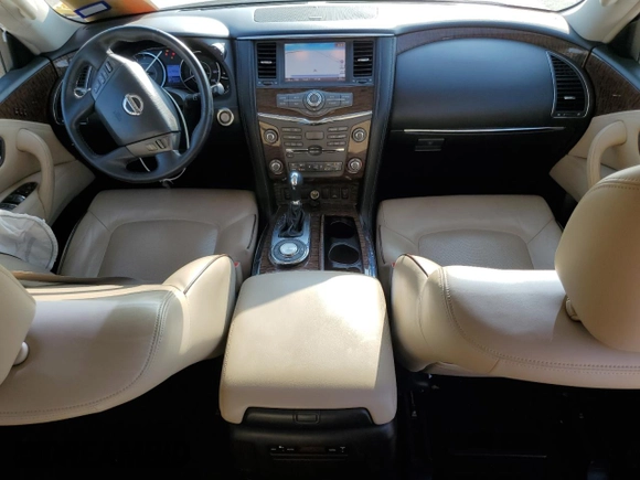 2017 Nissan Armada SL with VIN JN8AY2ND8H9010517, listed as a Copart auction lot 61785834 with 142,157 mi miles and Salvage Title. Bid and sale history available at carsss.com. Image 8.