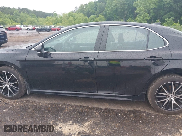 2023 Toyota Camry SE with VIN 4T1G11AKXPU827360, listed as a IAAI auction lot 42217356 with 57,497 mi miles and . Bid and sale history available at DreamBid. Image 14.