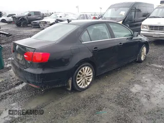 2014 Volkswagen Jetta TDI w/Premium with VIN 3VWLL7AJ1EM406360, listed as a IAAI auction lot 41857580 with 93,333 mi miles and . Bid and sale history available at DreamBid. Image 4.