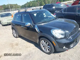 2013 MINI Countryman S ALL4 with VIN WMWZC5C51DWP30972, listed as a IAAI auction lot 40574307 with 153,570 mi miles and . Bid and sale history available at DreamBid. Image 1.