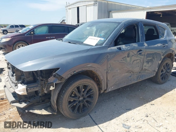 2023 Mazda CX-5 S Carbon Edition z VIN JM3KFBCM7P0164462, wystawiony jako IAAI lot #41919579 z przebiegiem 49 585 mil mil oraz . Historia ofert i sprzedaży dostępna na DreamBid. Obrazek 6.