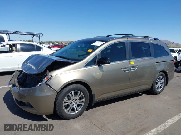 2012 Honda Odyssey EX-L z VIN 5FNRL5H63CB033049, wystawiony jako IAAI lot #42260501 z przebiegiem 165 693 mil mil oraz . Historia ofert i sprzedaży dostępna na DreamBid. Obrazek 18.