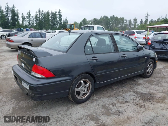 2002 Mitsubishi Lancer OZ-Rally z VIN JA3AJ86EX2U059845, wystawiony jako IAAI lot #42371709 z przebiegiem 207 665 mil mil oraz . Historia ofert i sprzedaży dostępna na DreamBid. Obrazek 4.