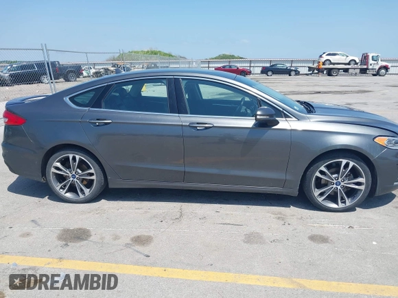 2020 Ford Fusion Titanium with VIN 3FA6P0D9XLR131042, listed as a IAAI auction lot 42560444 with 95,351 mi miles and . Bid and sale history available at DreamBid. Image 13.