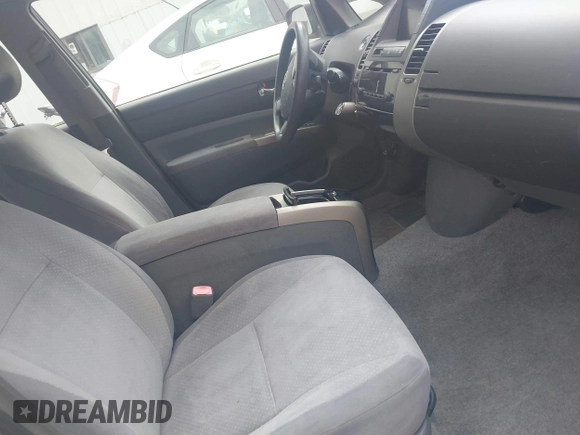 2005 Toyota Prius z VIN JTDKB20U257051452, wystawiony jako IAAI lot #42451660 z przebiegiem 166 106 mil mil oraz . Historia ofert i sprzedaży dostępna na DreamBid. Obrazek 5.