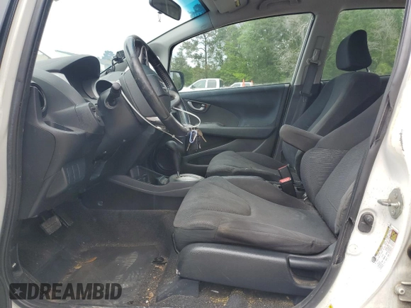 2010 Honda Fit Sport with VIN JHMGE8H44AS026305, listed as a Copart auction lot 52106015 with 0 mi miles and Salvage Title. Bid and sale history available at carsss.com. Image 7.