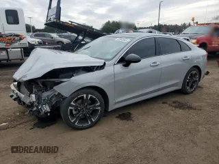2022 Kia K5 GT-Line z VIN 5XXG64J26NG099613, wystawiony jako Copart lot #52692065 z przebiegiem 105 475 mil mil oraz Szkody całkowita. Historia ofert i sprzedaży dostępna na DreamBid. Obrazek 1.