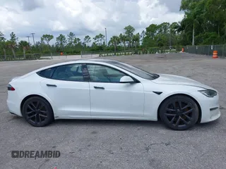 2022 Tesla Model S Plaid with VIN 5YJSA1E61NF460155, listed as a IAAI auction lot 42545167 with 51,711 mi miles and . Bid and sale history available at DreamBid. Image 13.
