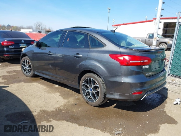 2015 Ford Focus SE with VIN 1FADP3F29FL268677, listed as a IAAI auction lot 42037244 with 118,018 mi miles. Bid and sale history available at carsss.com. Image 3.