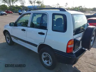 2001 Chevrolet Tracker z VIN 2CNBE13C916939402, wystawiony jako IAAI lot #42232082 z przebiegiem 103 693 mil mil oraz . Historia ofert i sprzedaży dostępna na DreamBid. Obrazek 3.