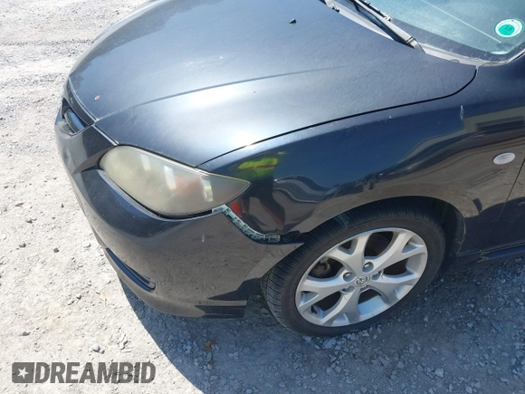 2007 Mazda 3 s Touring with VIN JM1BK323571631973, listed as a IAAI auction lot 41990310 with 287,946 mi miles. Bid and sale history available at carsss.com. Image 6.
