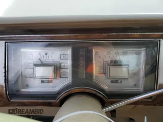 1987 Mercury Grand Marquis GS z VIN 2MEBM74F9HX714211, wystawiony jako Copart lot #43594205 z przebiegiem 26 933 mil mil oraz Szkody całkowita. Historia ofert i sprzedaży dostępna na DreamBid. Obrazek 9.