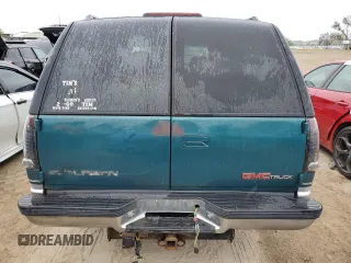 1996 GMC Suburban z VIN 1GKEC16R2TJ714191, wystawiony jako Copart lot #74660264 z przebiegiem 186 801 mil mil oraz Szkody całkowita. Historia ofert i sprzedaży dostępna na DreamBid. Obrazek 6.