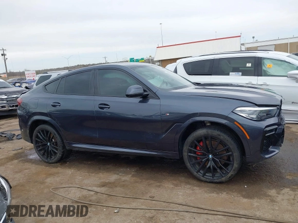 2022 BMW X6 xDrive40i z VIN 5UXCY6C08N9N30013, wystawiony jako IAAI lot #41772245 z przebiegiem 23 198 mil mil oraz . Historia ofert i sprzedaży dostępna na DreamBid. Obrazek 14.