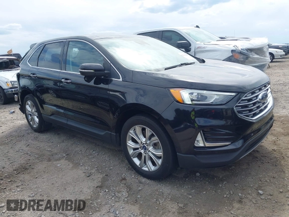 2021 Ford Edge Titanium z VIN 2FMPK3K99MBA16882, wystawiony jako IAAI lot #42214606 z przebiegiem 140 031 mil mil oraz . Historia ofert i sprzedaży dostępna na DreamBid. Obrazek 1.