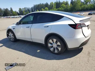 2020 Tesla Model Y Long Range with VIN 5YJYGDEF9LF023060, listed as a Copart auction lot 55462395 with 58,211 mi miles and Salvage Title. Bid and sale history available at DreamBid. Image 2.
