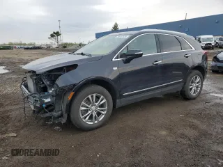 2022 Cadillac XT5 AWD Premium Luxury with VIN 1GYKNDR41NZ159274, listed as a Copart auction lot 55457335 with 21,439 mi miles and Salvage title. Bid and sale history available at DreamBid. Image 1.
