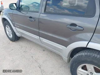 2005 Ford Escape Hybrid with VIN 1FMCU95H55KC07544, listed as a IAAI auction lot 42104756 with 250,109 mi miles. Bid and sale history available at carsss.com. Image 12.