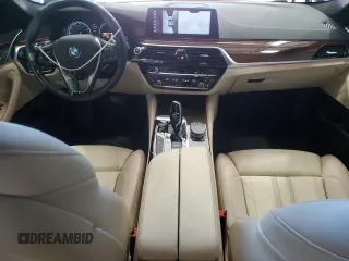 2018 BMW 5 Series 540i xDrive with VIN WBAJE7C56JWC57314, listed as a Copart auction lot 60610715 with 73,015 mi miles and Salvage title. Bid and sale history available at DreamBid. Image 8.
