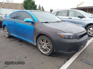 2010 Scion tC with VIN JTKDE3B79A0315842, listed as a IAAI auction lot 41222055 with 146,328 mi miles. Bid and sale history available at carsss.com. Image 1.