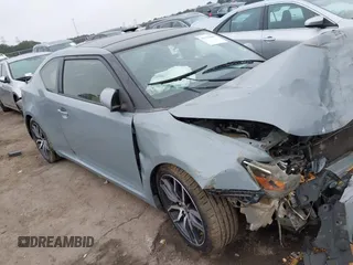 2015 Scion tC z VIN JTKJF5C78FJ004561, wystawiony jako IAAI lot #41195800 z przebiegiem 173 649 mil mil oraz . Historia ofert i sprzedaży dostępna na DreamBid. Obrazek 1.