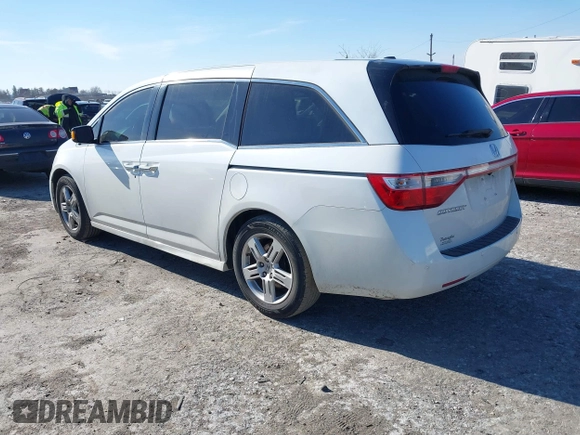 2012 Honda Odyssey Touring with VIN 5FNRL5H96CB010696, listed as a IAAI auction lot 41605868 with 109,411 mi miles and . Bid and sale history available at carsss.com. Image 3.