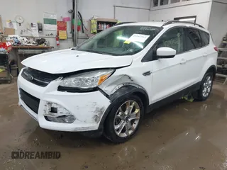 2014 Ford Escape SE with VIN 1FMCU9G99EUC15477, listed as a IAAI auction lot 42147162 with 98,886 mi miles and . Bid and sale history available at DreamBid. Image 17.