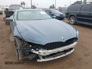 2020 BMW 8 Series M850i xDrive with VIN WBABC4C03LCE83098, listed as a IAAI auction lot 41430012 with 27,073 mi miles. Bid and sale history available at carsss.com. Image 1.
