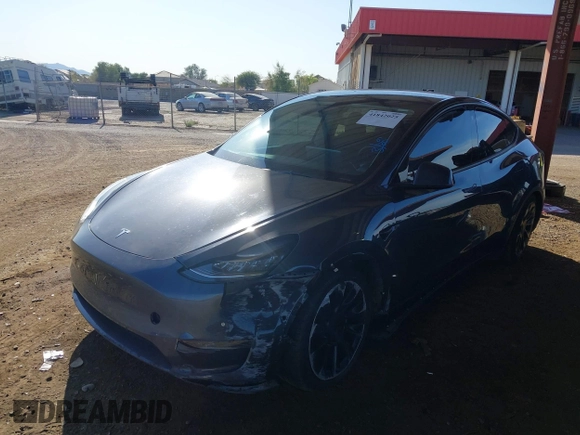 2022 Tesla Model Y Long Range with VIN 7SAYGDEE2NA017434, listed as a IAAI auction lot 41842025 with 35,164 mi miles and . Bid and sale history available at DreamBid. Image 2.