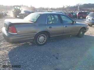 2001 Ford Crown Victoria with VIN 2FAFP73W71X112219, listed as a IAAI auction lot 41879317 with 159,344 mi miles. Bid and sale history available at carsss.com. Image 4.