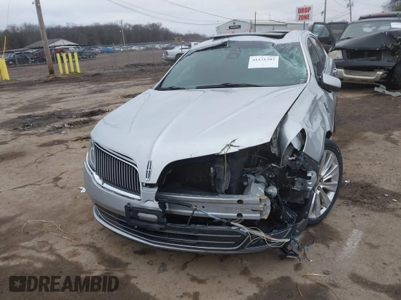 2013 Lincoln MKS EcoBoost with VIN 1LNHL9FT9DG611640, listed as a IAAI auction lot 41131303 with 135,550 mi miles and . Bid and sale history available at DreamBid. Image 2.