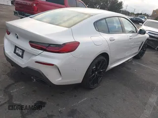2023 BMW 8 Series 840i z VIN WBAGV2C02PCL77961, wystawiony jako IAAI lot #41156644 z przebiegiem 7059 mil mil oraz . Historia ofert i sprzedaży dostępna na DreamBid. Obrazek 4.