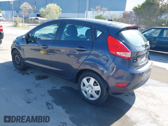 2013 Ford Fiesta SE with VIN 3FADP4EJ8DM221179, listed as a IAAI auction lot 41958070 with 197,454 mi miles. Bid and sale history available at carsss.com. Image 3.