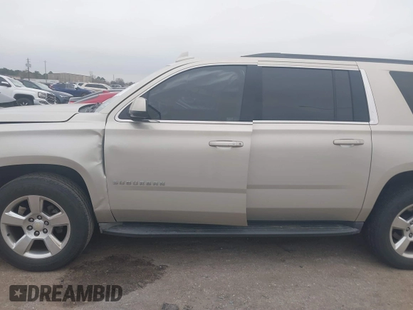 2015 Chevrolet Suburban LT with VIN 1GNSCJKC4FR744208, listed as a IAAI auction lot 41612915 with 87,445 mi miles and . Bid and sale history available at DreamBid. Image 14.