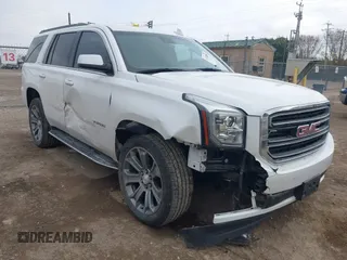 2019 GMC Yukon SLT with VIN 1GKS1BKCXKR329607, listed as a IAAI auction lot 41188239 with 84,940 mi miles. Bid and sale history available at carsss.com. Image 1.