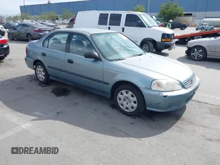 2000 Honda Civic LX with VIN 2HGEJ6676YH536339, listed as a IAAI auction lot 42019556 with 242,284 mi miles. Bid and sale history available at carsss.com. Image 1.