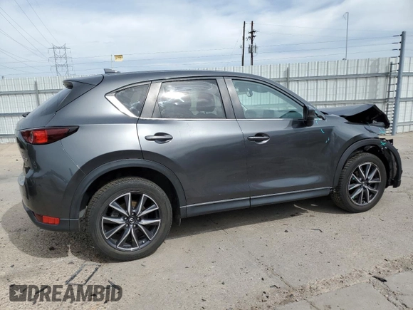 2018 Mazda CX-5 Touring z VIN JM3KFBCM2J0379190, wystawiony jako Copart lot #59233075 z przebiegiem 51 985 mil mil oraz Szkoda całkowita • Salvage title. Historia ofert i sprzedaży dostępna na DreamBid. Obrazek 3.
