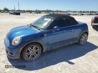 2013 MINI Roadster with VIN WMWSY1C56DT625387, listed as a Copart auction lot 47006025 with 144,487 mi miles and Salvage Title. Bid and sale history available at DreamBid. Image 1.