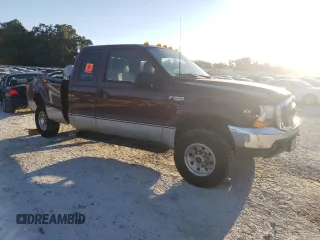 2000 Ford F-250 XL with VIN 1FTNX21L6YEE29549, listed as a Copart auction lot 74982324 with 133,883 mi miles and Salvage title. Bid and sale history available at DreamBid. Image 4.