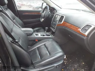 2013 Jeep Grand Cherokee Limited with VIN 1C4RJFBG4DC633137, listed as a IAAI auction lot 41235064 with 163,820 mi miles. Bid and sale history available at carsss.com. Image 5.