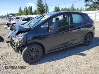 2018 Honda Fit Sport z VIN 3HGGK5H66JM719199, wystawiony jako Copart lot #58607585 z przebiegiem Nie podano mil oraz Szkoda całkowita • Salvage title. Historia ofert i sprzedaży dostępna na DreamBid. Obrazek 1.