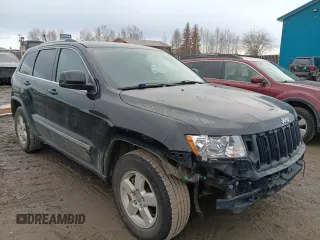 2011 Jeep Grand Cherokee Laredo z VIN 1J4RR4GG5BC508211, wystawiony jako Copart lot #53729935 z przebiegiem 124 408 mil mil oraz Szkoda całkowita • Salvage title. Historia ofert i sprzedaży dostępna na DreamBid. Obrazek 4.