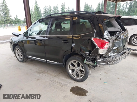 2018 Subaru Forester Touring with VIN JF2SJAWC2JH598982, listed as a IAAI auction lot 42455652 with 57,254 mi miles and . Bid and sale history available at DreamBid. Image 3.